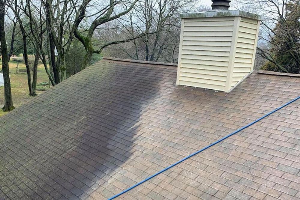 Roof cleaning before and after image showing moss and grime removal from shingles.